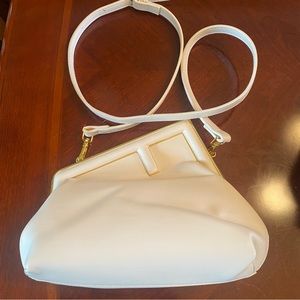 White purse with shoulder strap